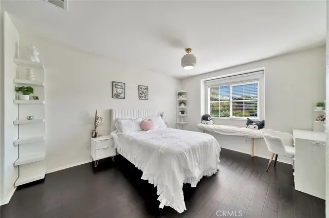 a bathroom with a double vanity sink toilet and shower