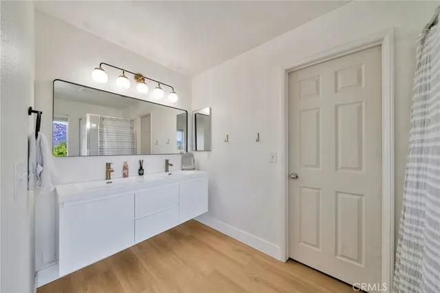 a view of a terrace with chairs and wooden fence