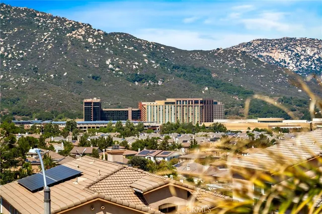 a playing room with furniture and a wooden floor