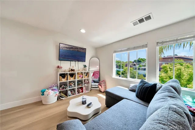 an aerial view of a house with street