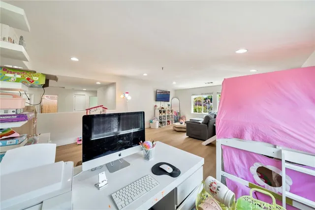 an aerial view of a house with a lake view