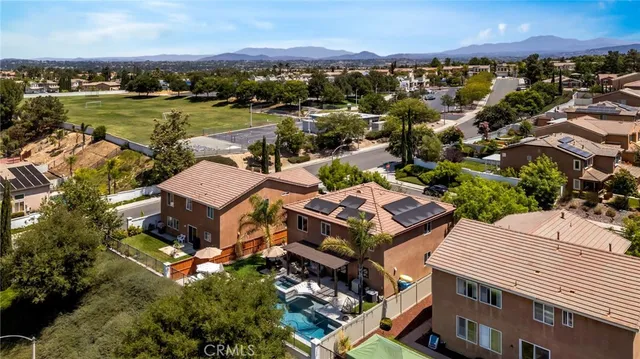 an aerial view of residential house and sandy dunes