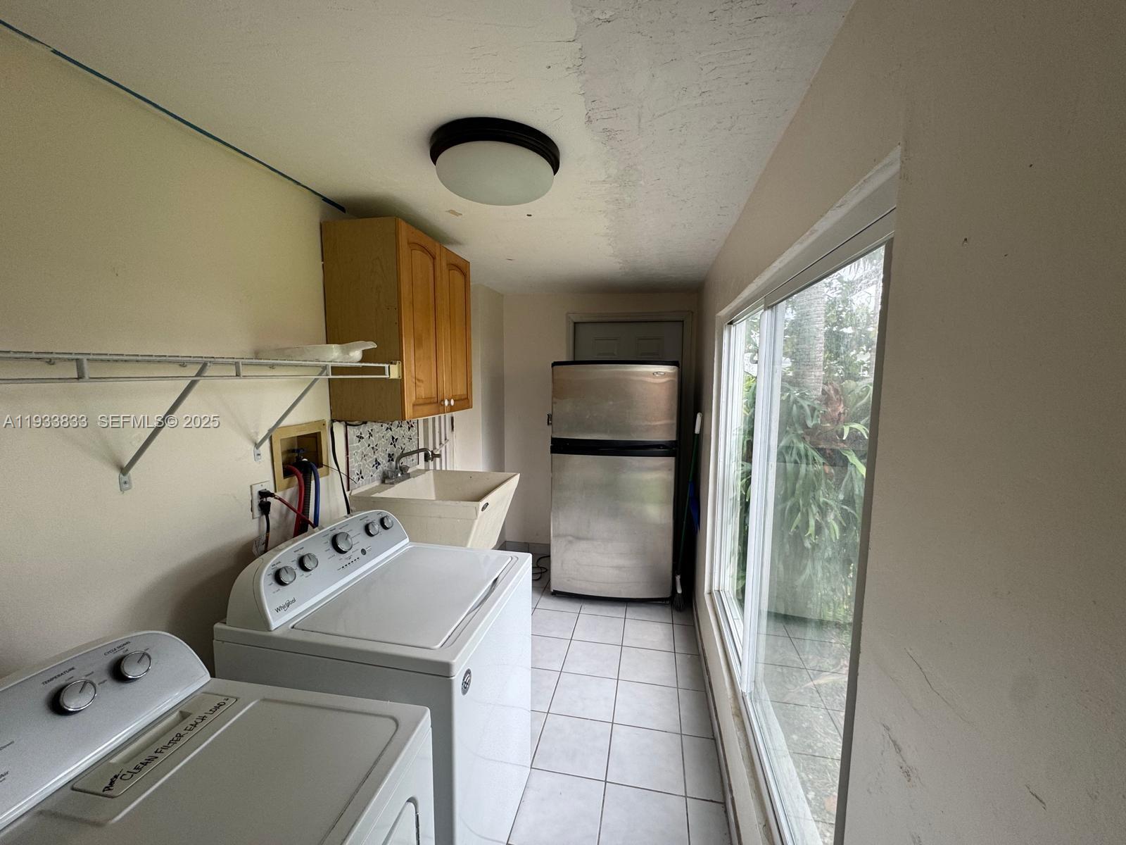 18600 Southwest 97th Avenue Cutler Bay, FL 33157 - Photo 14 of 23 a room with storage and utility