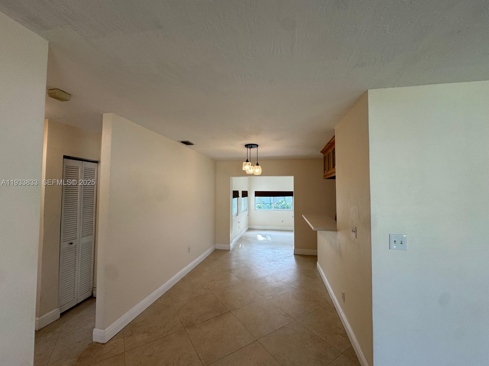 18600 Southwest 97th Avenue Cutler Bay, FL 33157 - Photo 6 of 23 a view of a hallway with a living room
