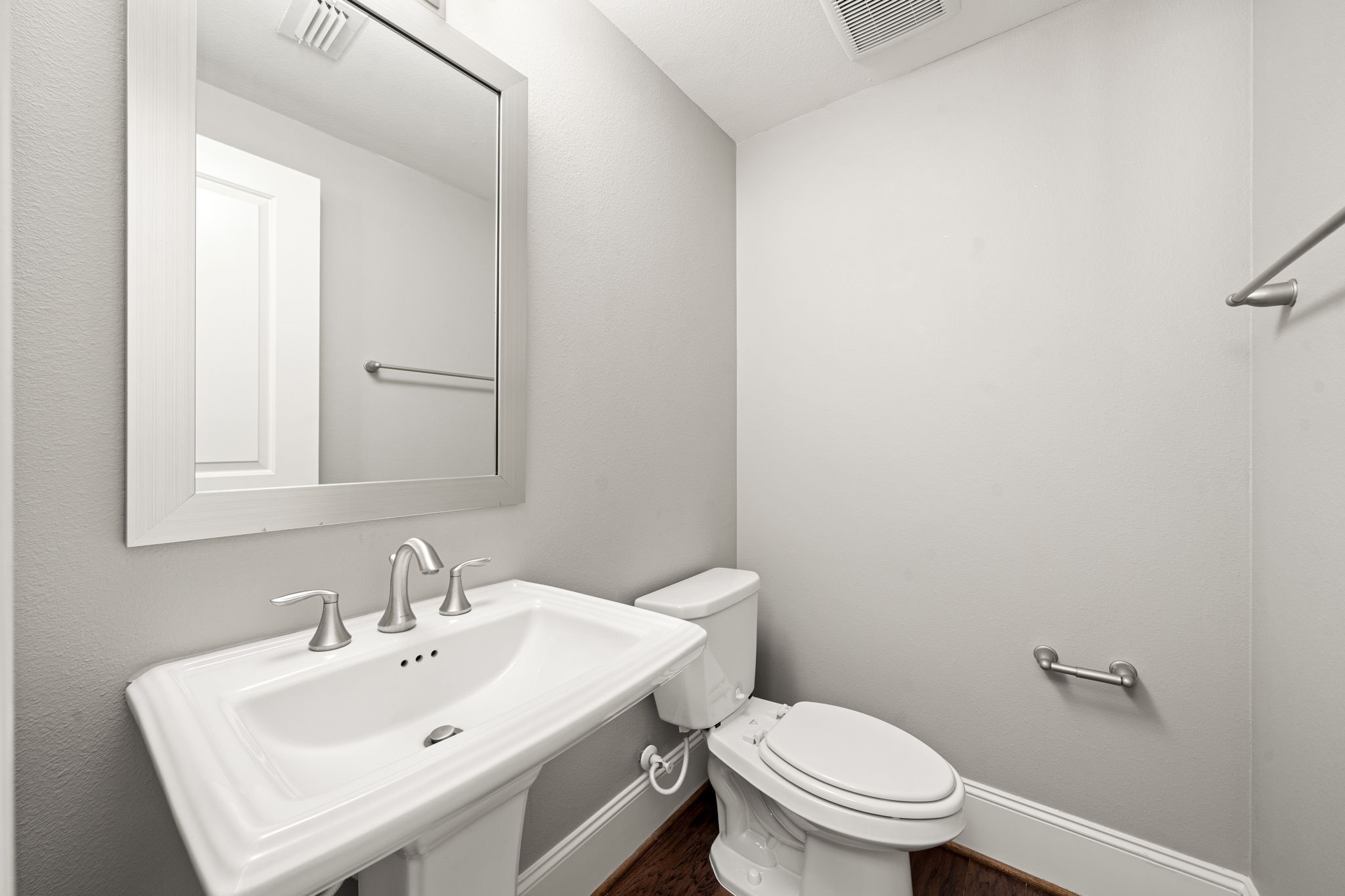 6703 Highclere Manor Lane Houston, TX 77055 - Photo 24 of 36 a bathroom with a sink a toilet and mirror