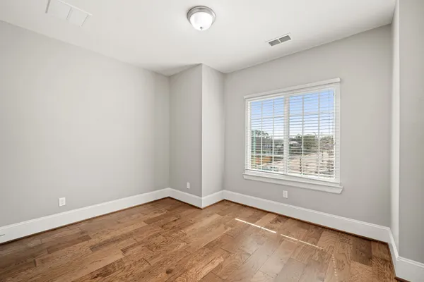 a view of a livingroom with wooden floor