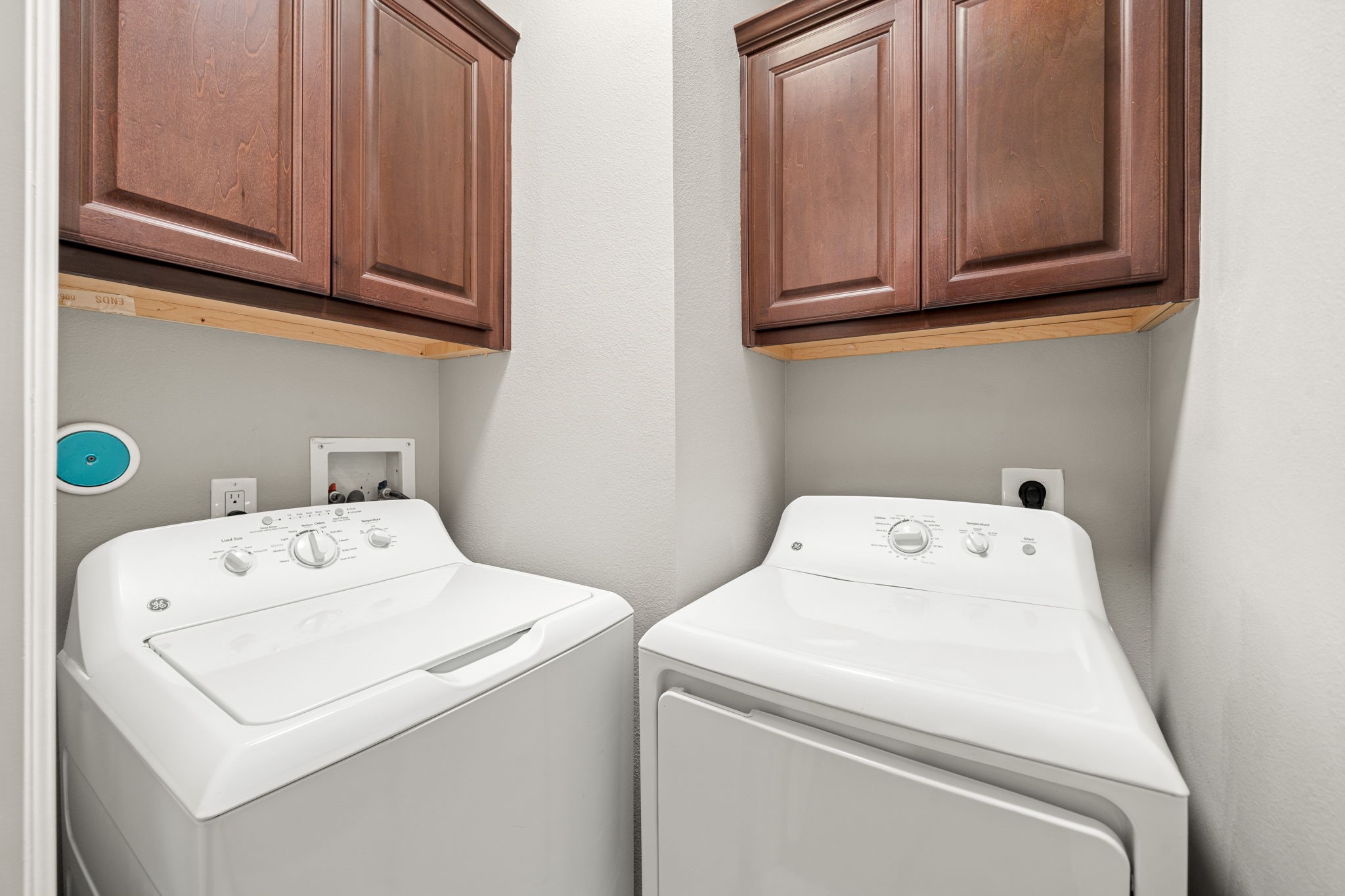 6703 Highclere Manor Lane Houston, TX 77055 - Photo 33 of 36 a utility room with dryer and washer