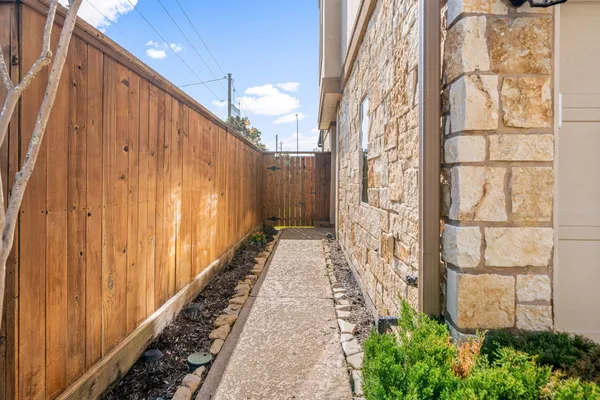 a view of a pathway of a building with wooden walls