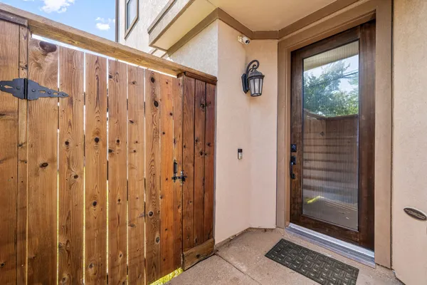 a view of an entryway with wooden floor and door