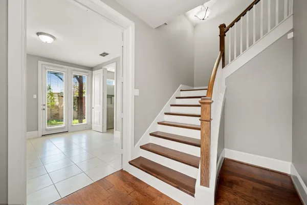 a view of entryway with workspace and stairs