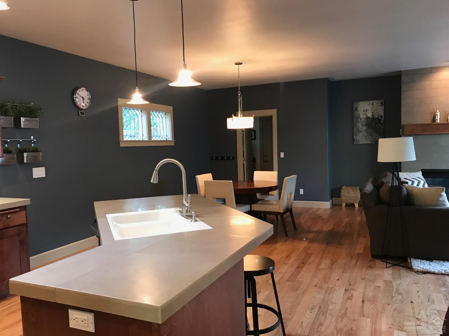 2422 Northwest Awbrey Road Bend, OR 97703 - Photo 9 of 21 a view of a dining room with furniture and wooden floor