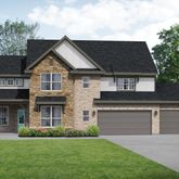 a front view of a house with a garden and yard