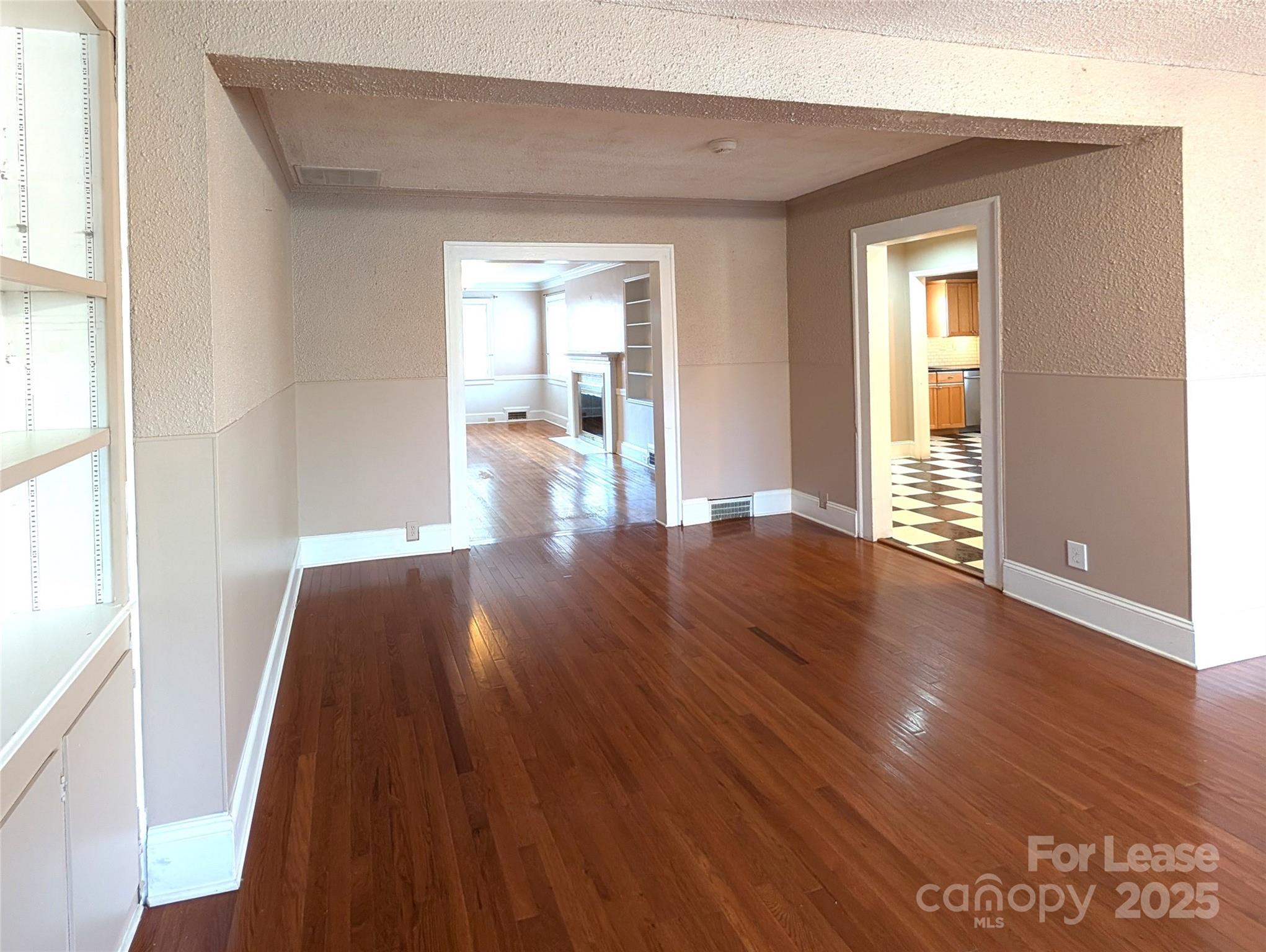 539 Marsh Road Charlotte, NC 28209 - Photo 12 of 23 a view of an empty room with wooden floor and a window