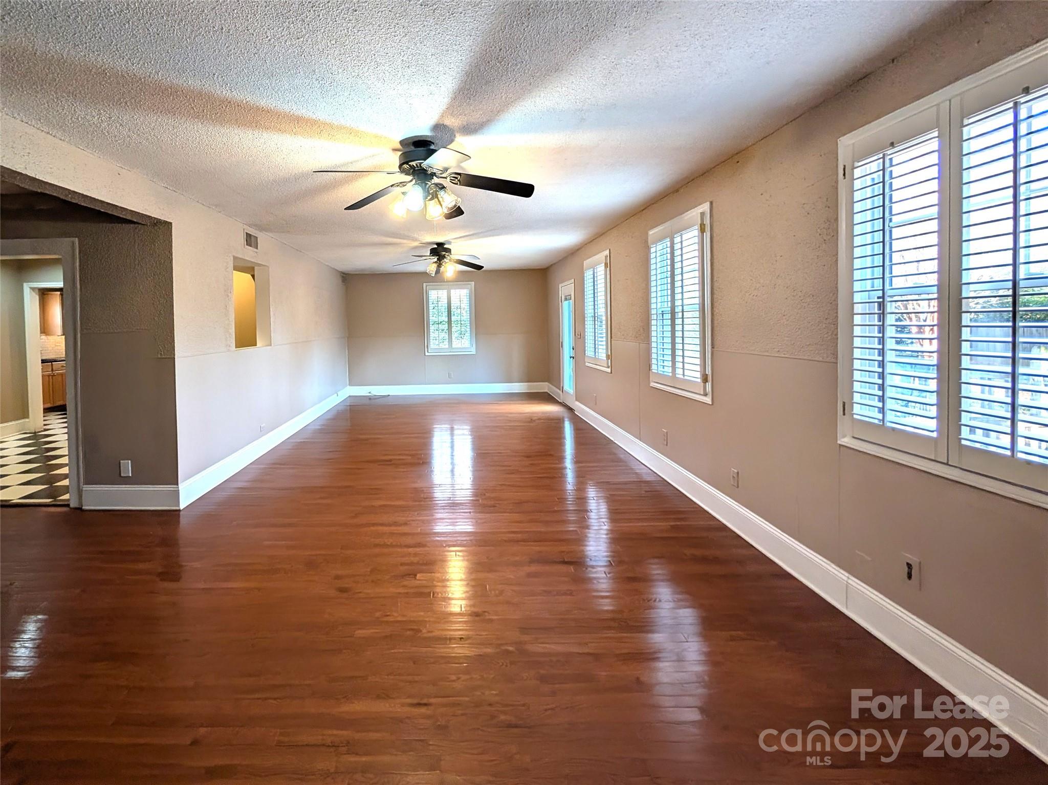 539 Marsh Road Charlotte, NC 28209 - Photo 13 of 23 a view of an empty room with wooden floor and a window