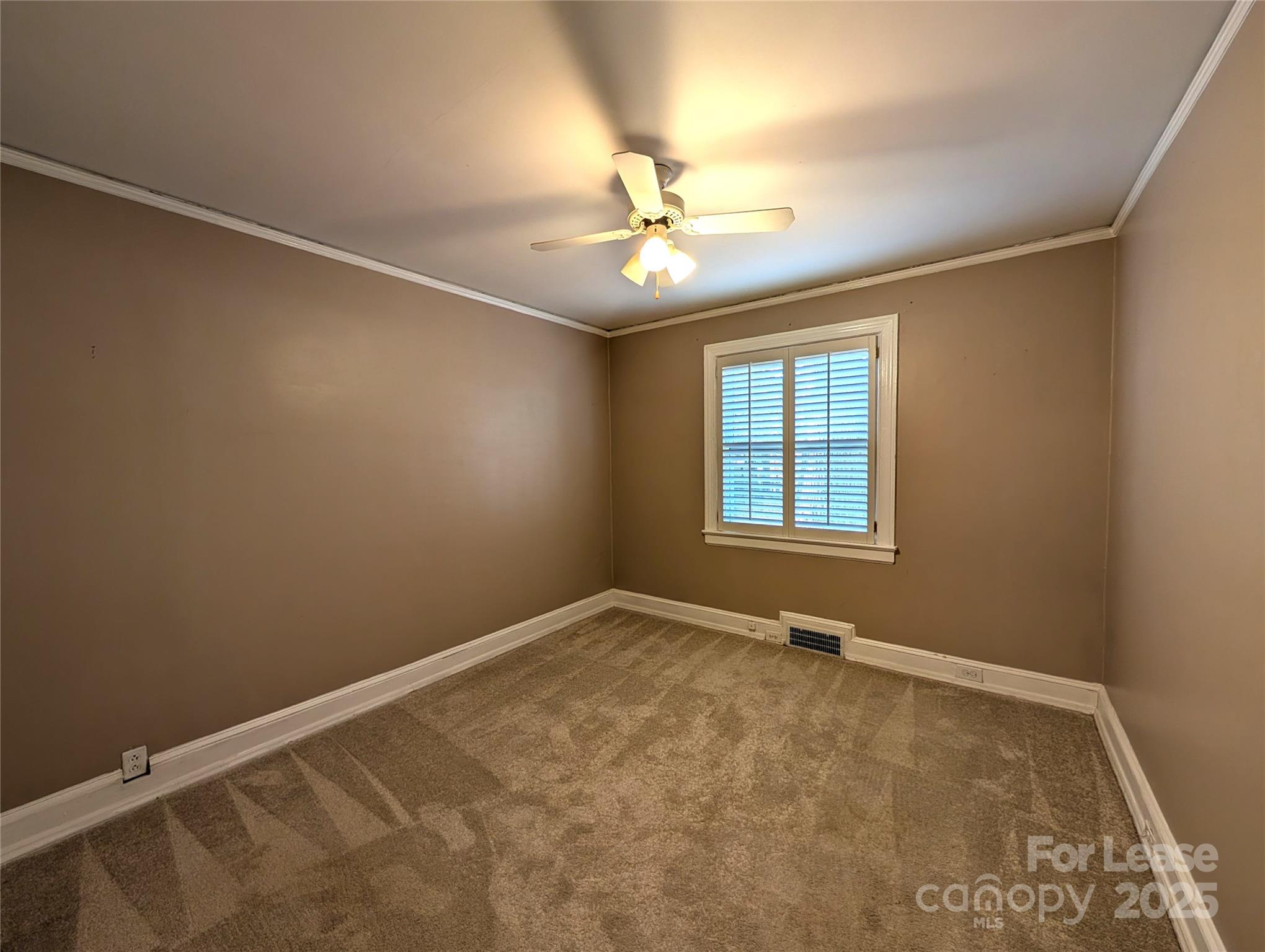 539 Marsh Road Charlotte, NC 28209 - Photo 15 of 23 an empty room with windows and fan
