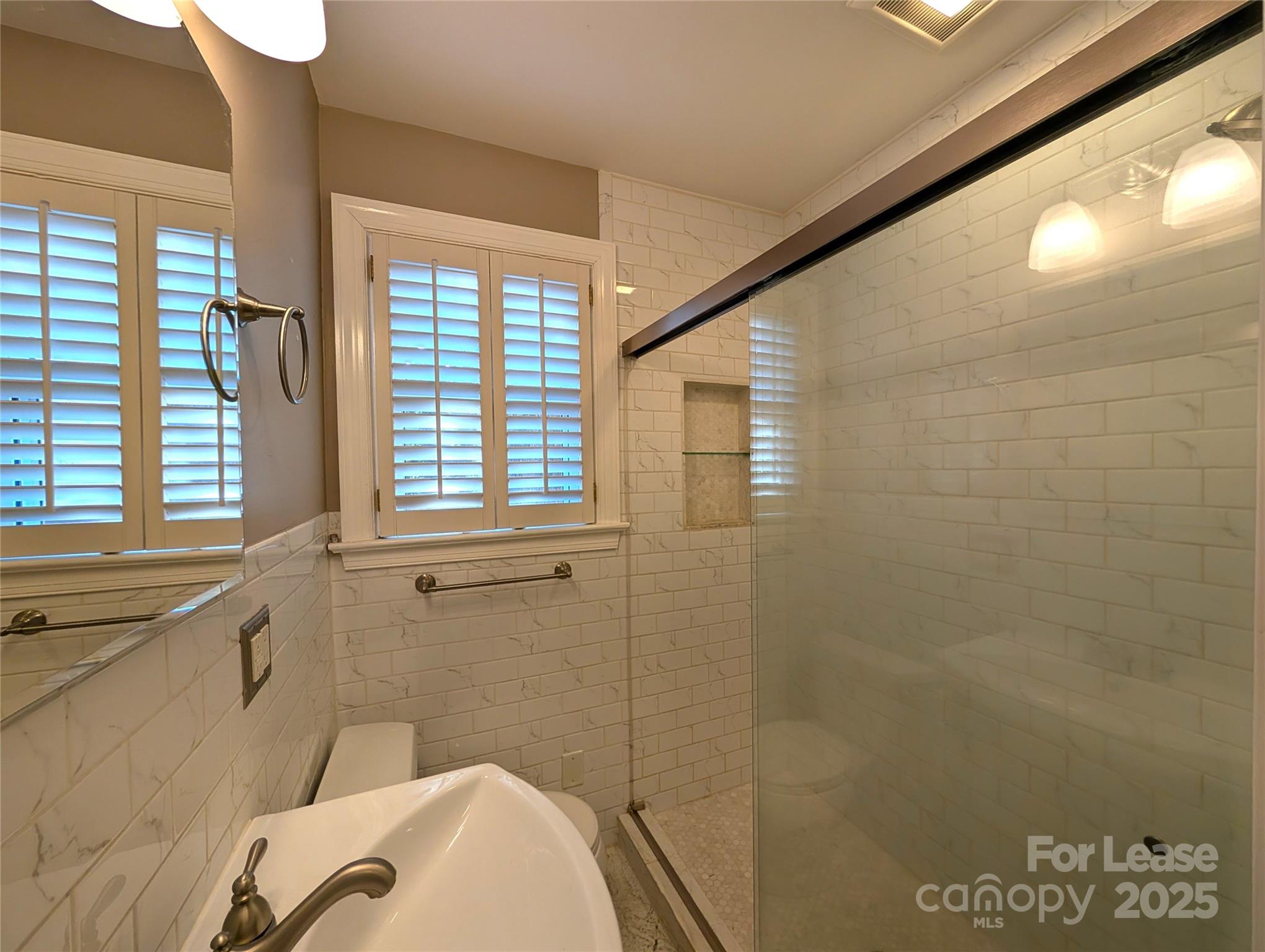539 Marsh Road Charlotte, NC 28209 - Photo 17 of 23 a bathroom with a sink and a bathtub