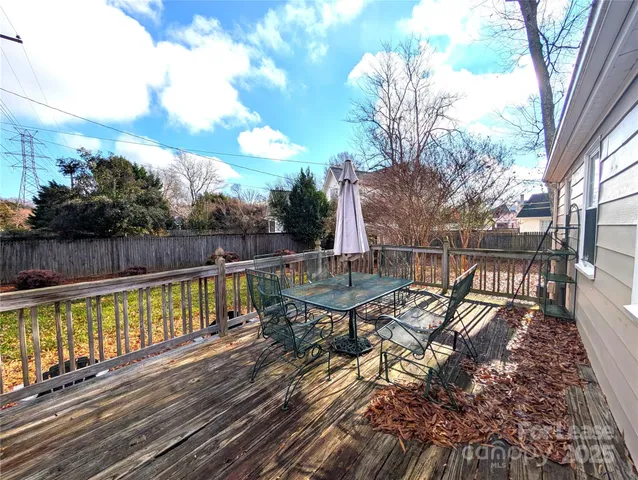 a view of a balcony with wooden floor