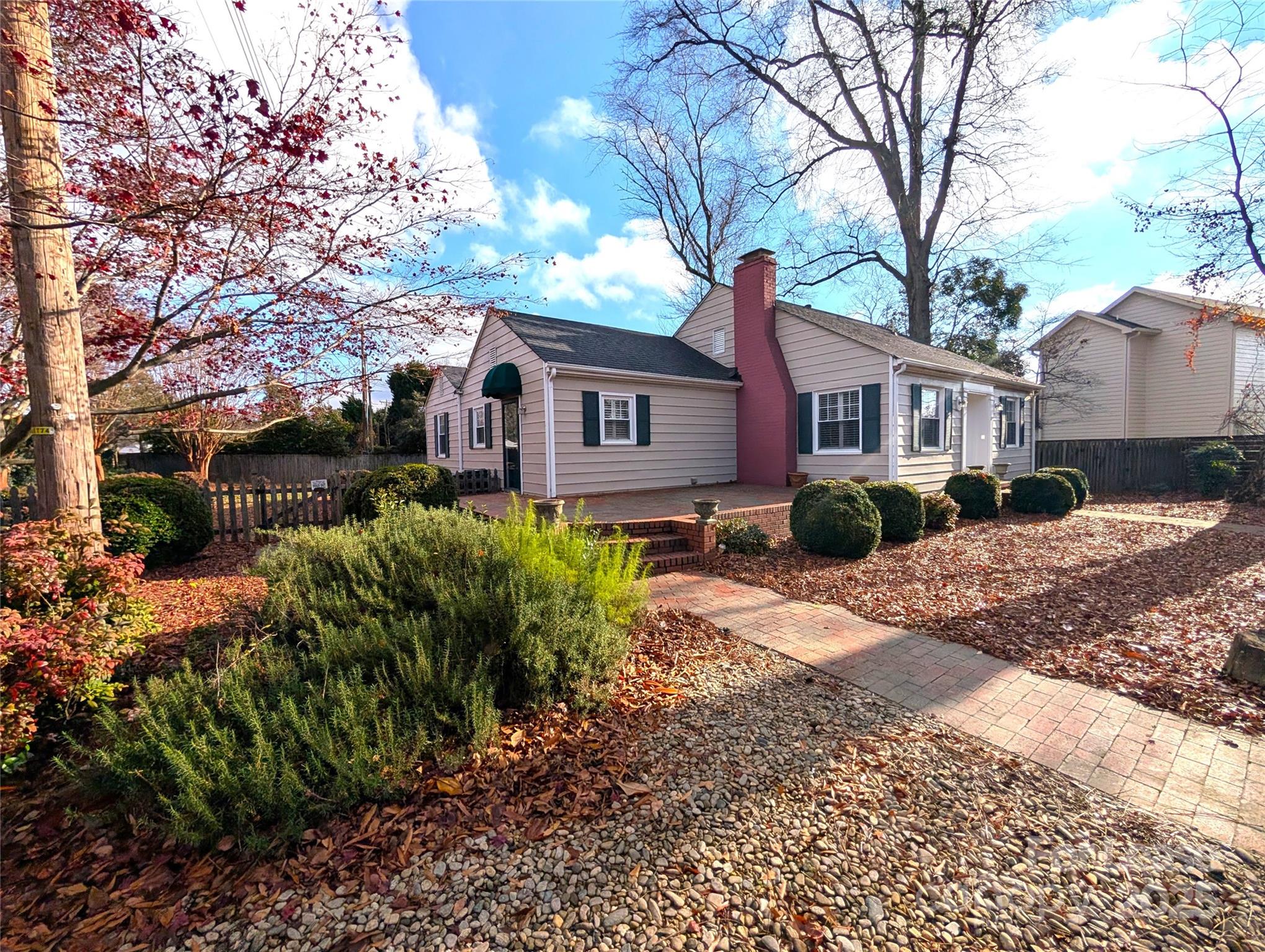 539 Marsh Road Charlotte, NC 28209 - Photo 2 of 23 a front view of a house with a yard and shrubs