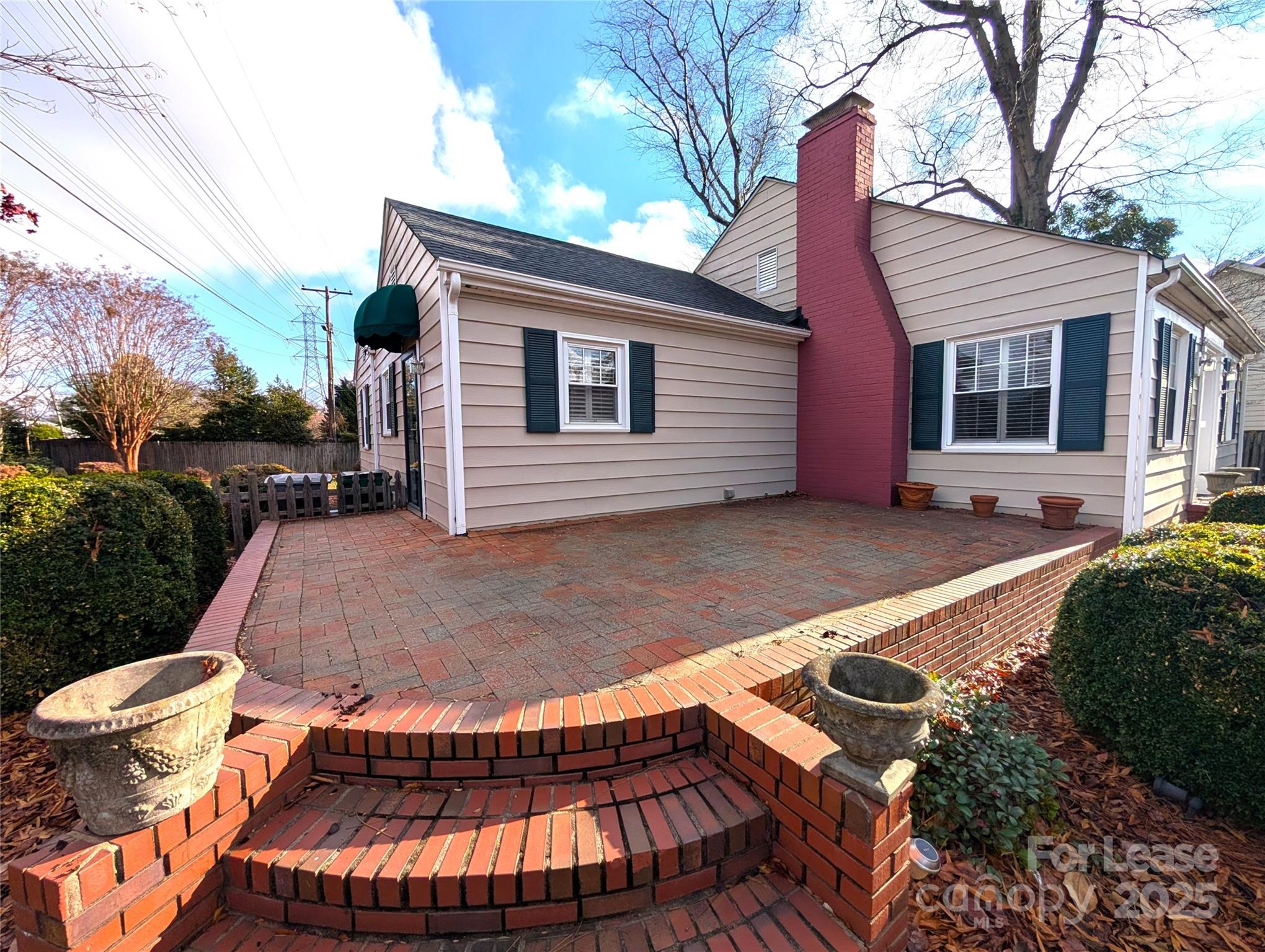 539 Marsh Road Charlotte, NC 28209 - Photo 3 of 23 a backyard of a house with yard and outdoor seating