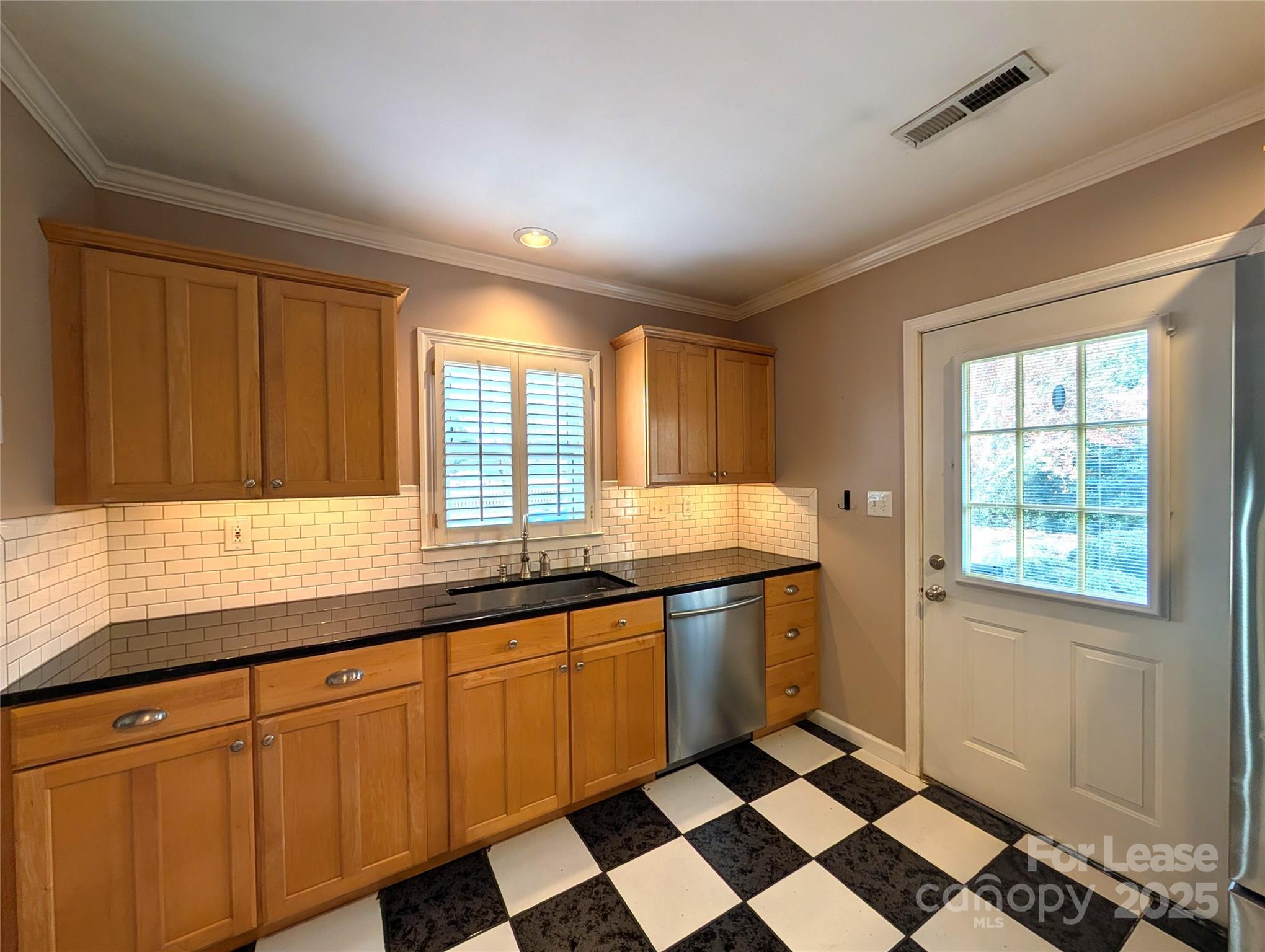 539 Marsh Road Charlotte, NC 28209 - Photo 5 of 23 a kitchen with stainless steel appliances granite countertop a sink and cabinets
