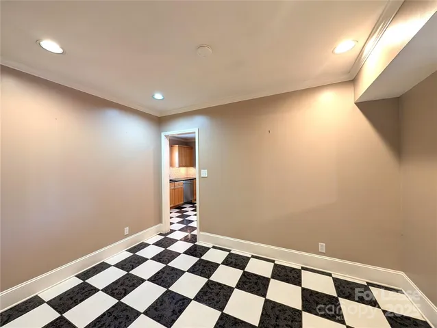 a view of a room with a black and white checkered floor