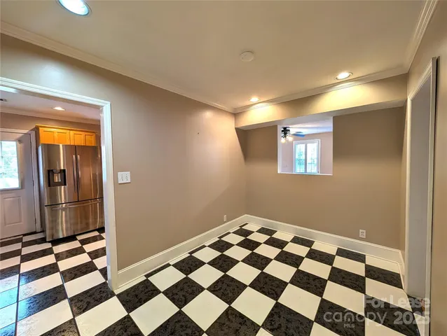 a view of a room with a black white checkered floor