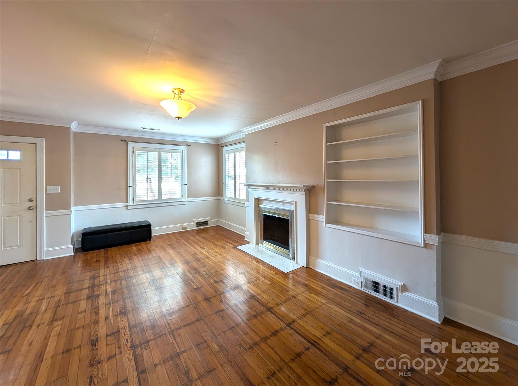 539 Marsh Road Charlotte, NC 28209 - Photo 10 of 23 a view of a livingroom with furniture a fireplace and window
