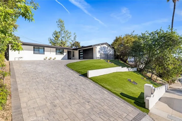 a view of a backyard with a garden