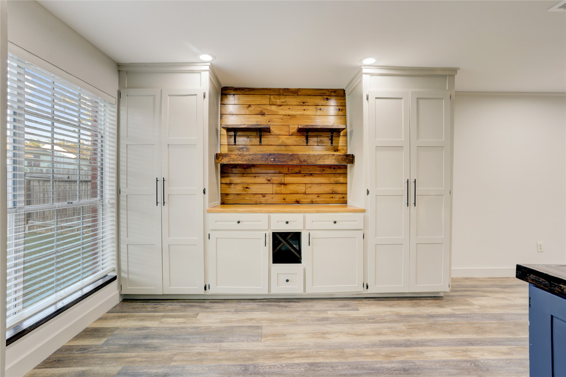 3122 Rimrock Drive Missouri City, TX 77459 - Photo 11 of 29 a view of a room with wooden floor and cabinet