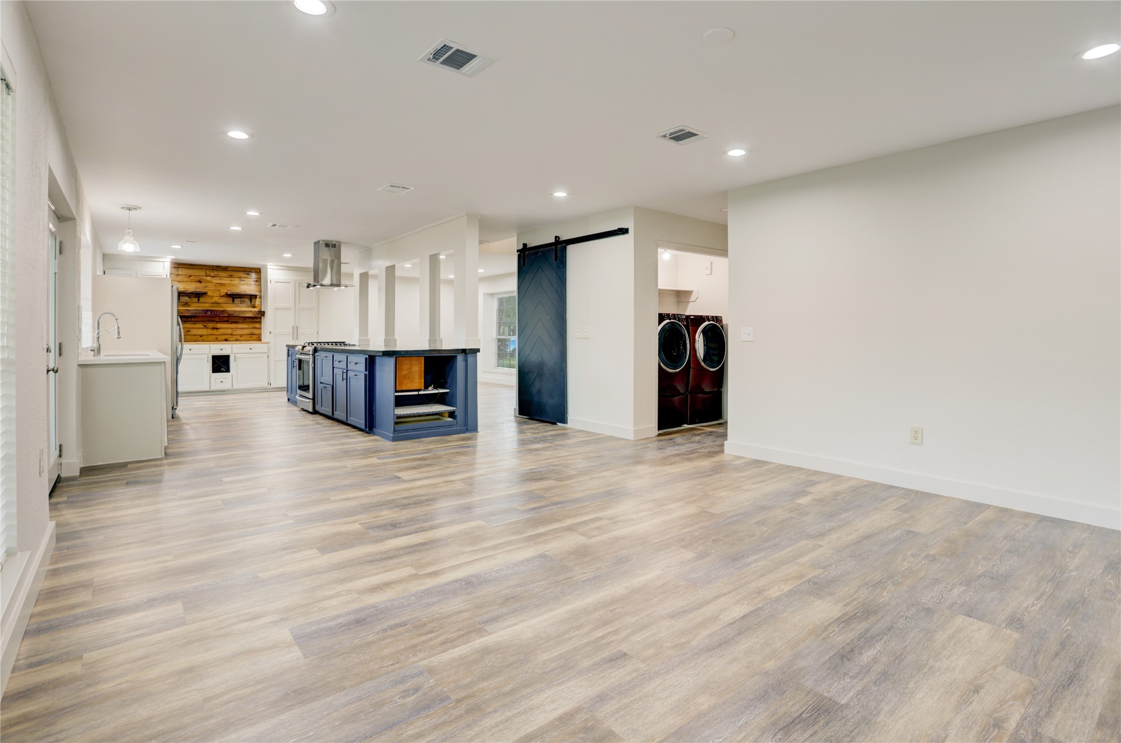 3122 Rimrock Drive Missouri City, TX 77459 - Photo 13 of 29 a view of a kitchen with a refrigerator and a stove top oven