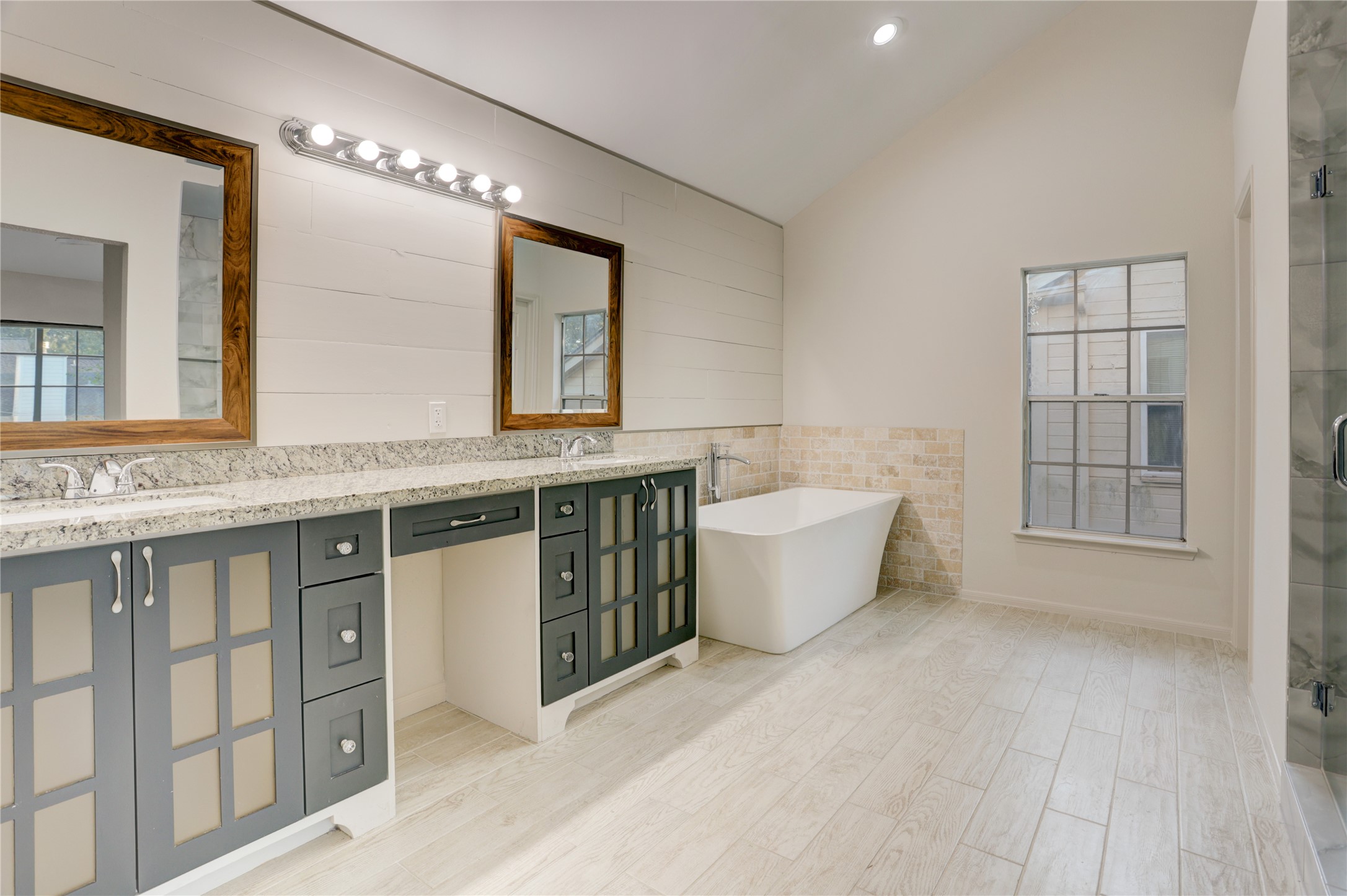 3122 Rimrock Drive Missouri City, TX 77459 - Photo 19 of 29 a spacious bathroom with a granite countertop sink and a mirror