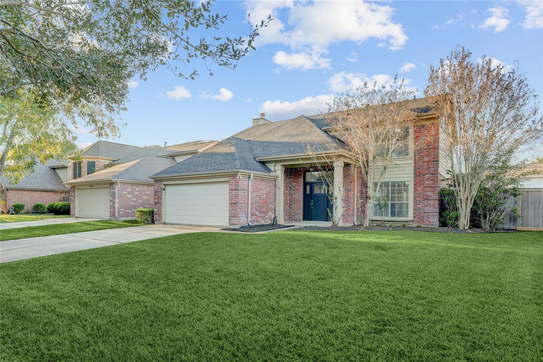 3122 Rimrock Drive Missouri City, TX 77459 - Photo 2 of 29 a view of a house with a yard and pathway