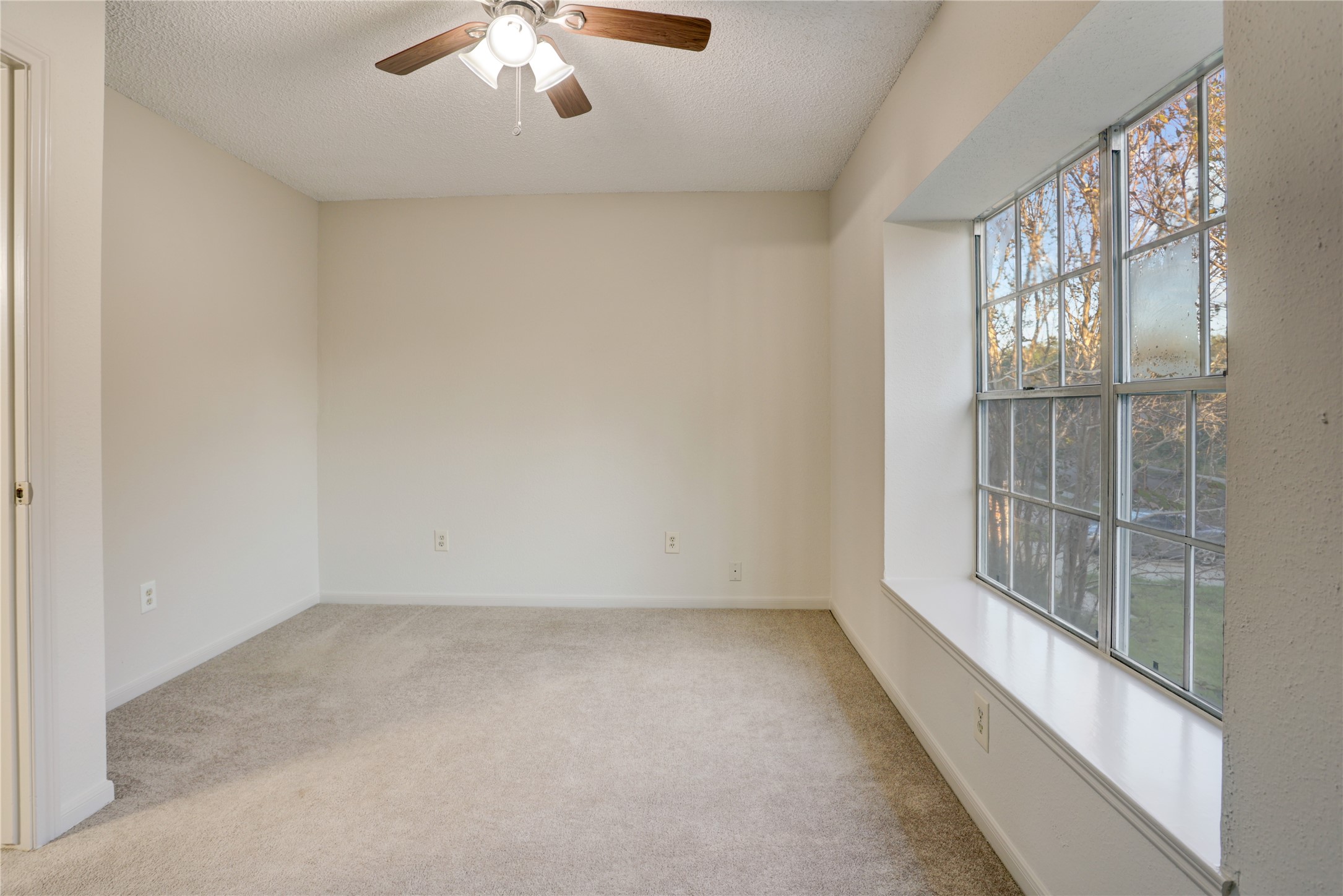 3122 Rimrock Drive Missouri City, TX 77459 - Photo 23 of 29 an empty room with chandelier fan