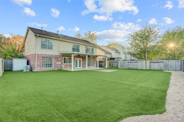 a view of a house with a backyard