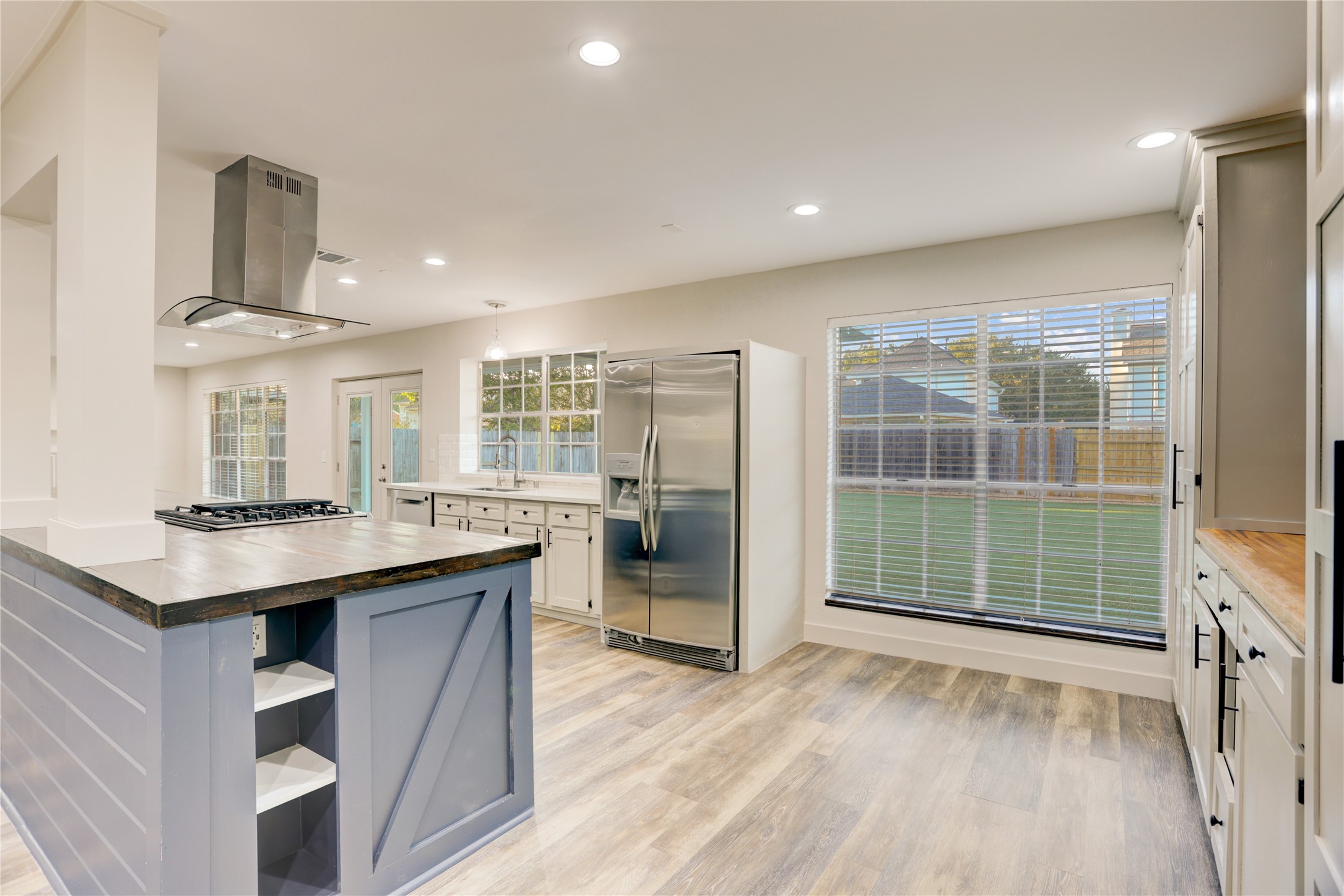3122 Rimrock Drive Missouri City, TX 77459 - Photo 8 of 29 a kitchen with stainless steel appliances granite countertop a sink stove and refrigerator