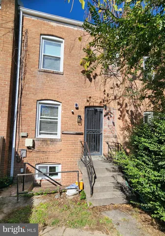 a view of a backyard of the house