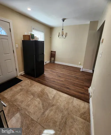a view of a storage & utility room with wooden floor