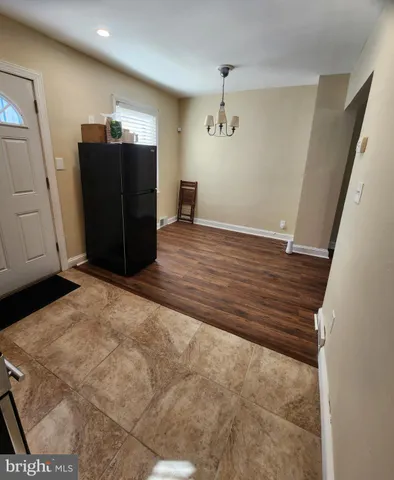 a view of a storage & utility room with wooden floor