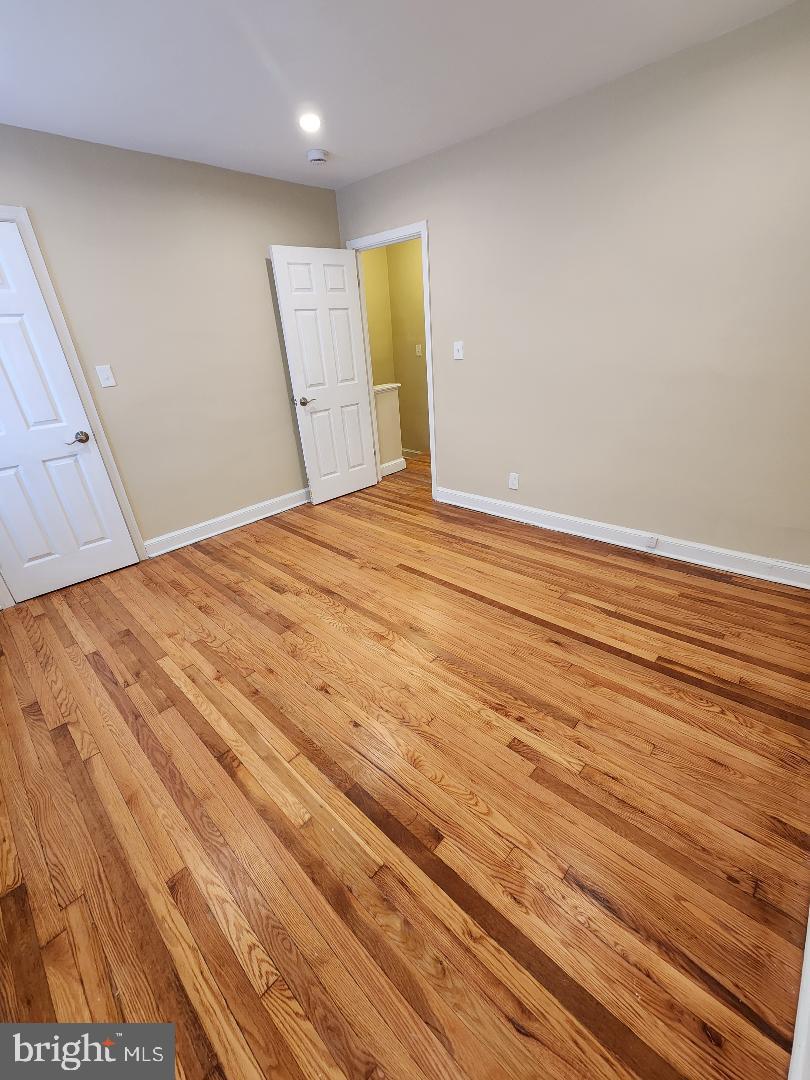 2330 14th Place Southeast Washington, DC 20020 - Photo 8 of 22 a view of empty room with wooden floor