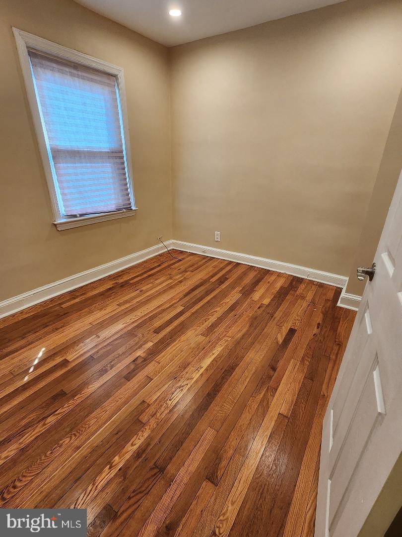 2330 14th Place Southeast Washington, DC 20020 - Photo 10 of 22 a view of a room with wooden floor and windows