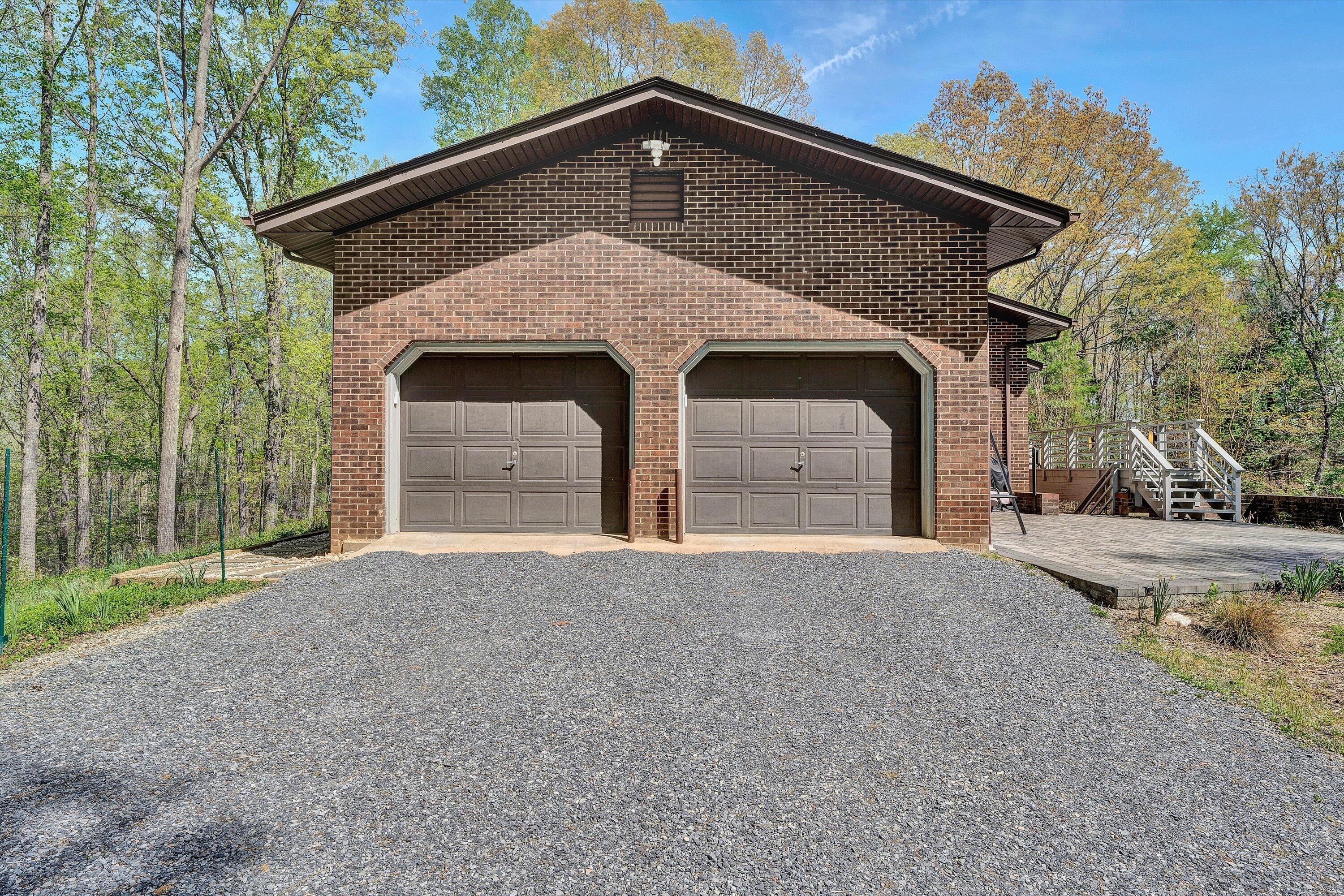 1124 Old Hollow Road Buchanan, VA 24066 - Photo 58 of 73 a front view of a house with a yard and garage
