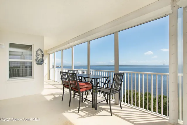 a view of a balcony with chairs