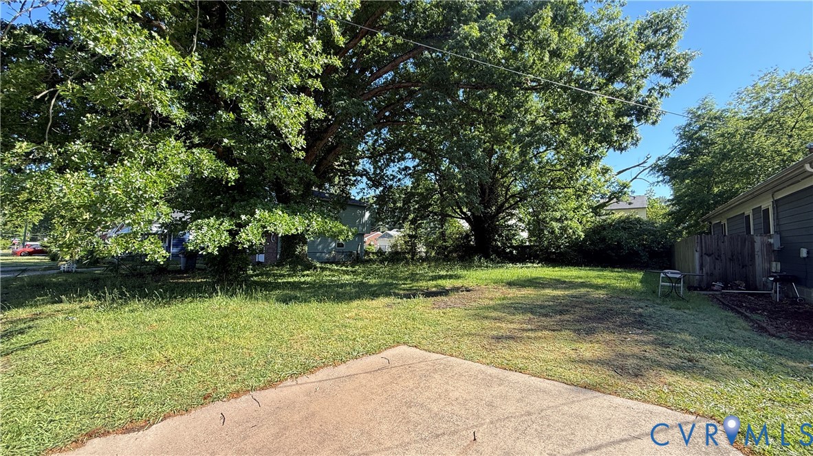 806 Ridgeway Avenue Hampton, VA 23661 - Photo 3 of 7 Expansive green space featuring a concrete patio,