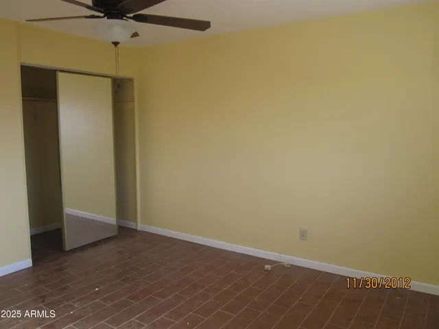 an empty room with a wooden door