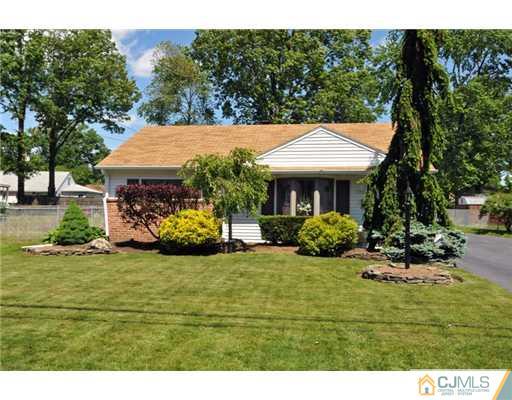 44 Idlewild Road Edison, NJ 08817 - Photo 2 of 15 a view of a house with backyard porch and sitting area