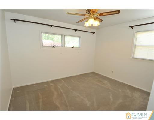 44 Idlewild Road Edison, NJ 08817 - Photo 14 of 15 a view of an empty room with a window