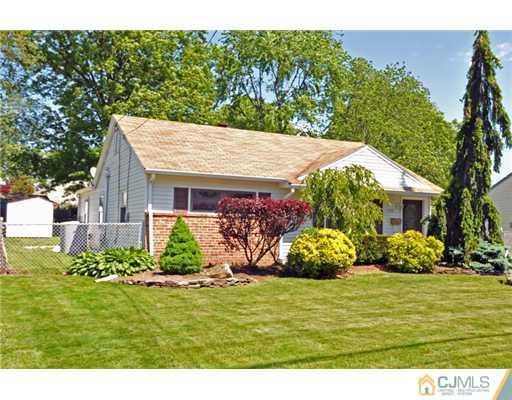 44 Idlewild Road Edison, NJ 08817 - Photo 3 of 15 a view of a house with a yard and potted plants