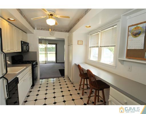 44 Idlewild Road Edison, NJ 08817 - Photo 4 of 15 a kitchen with a sink cabinets and window