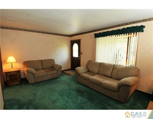 44 Idlewild Road Edison, NJ 08817 - Photo 9 of 15 a living room with furniture and a large window