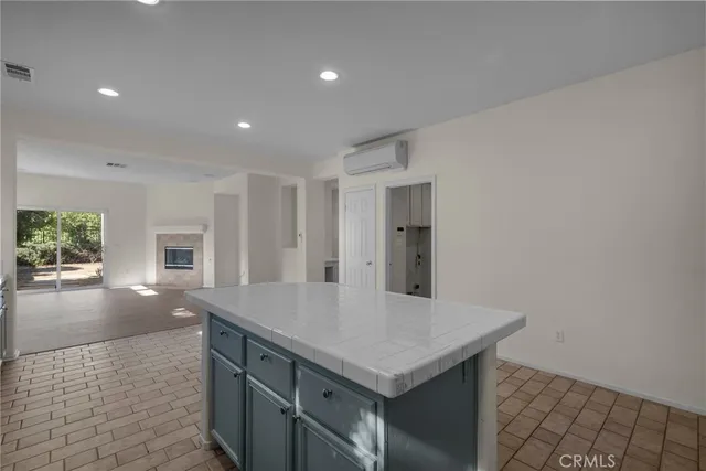 a kitchen with granite countertop a stove and a sink